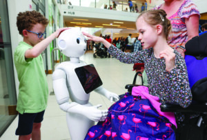 Eoghan and Aoife Byrne (both aged 8) meet Pepper the Humanoid.