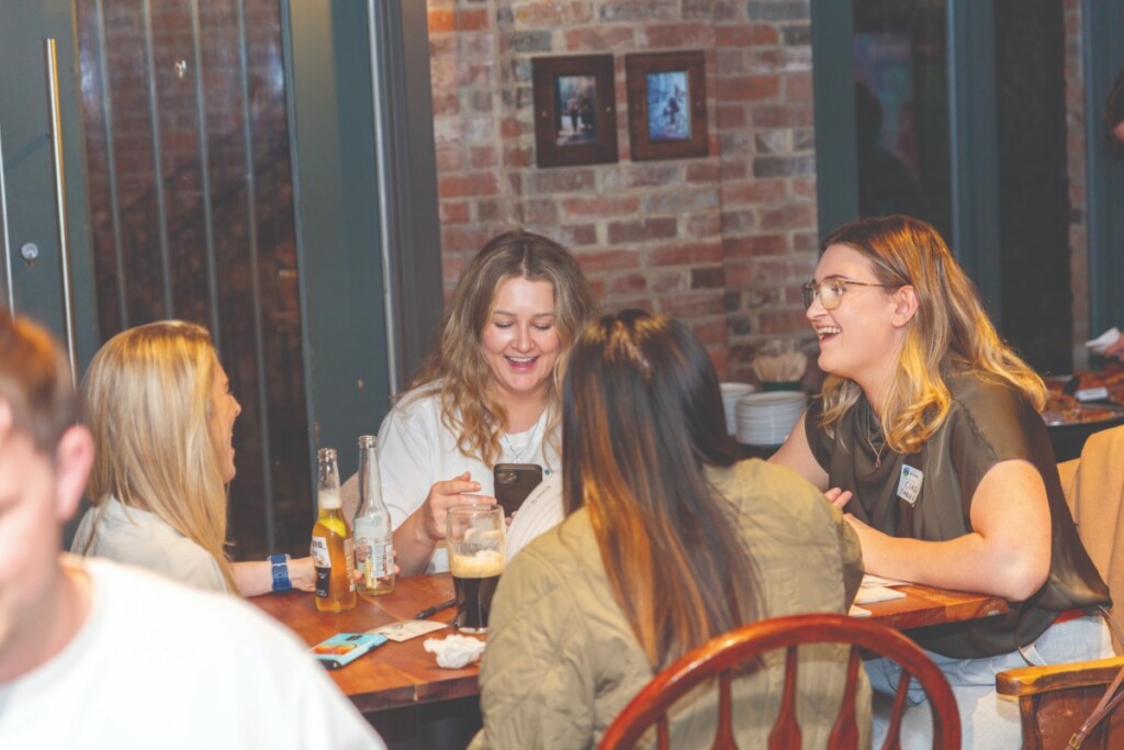 UCD Alumni Chapter Representative Ciara Dempsey at her team table at the Pub Quiz in Vancouver.