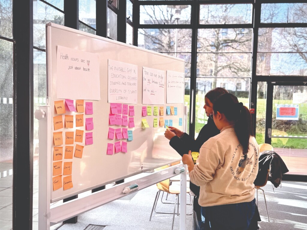 Students Kaja Zeman and Sherlene Yun Soo working to identify complex problems.